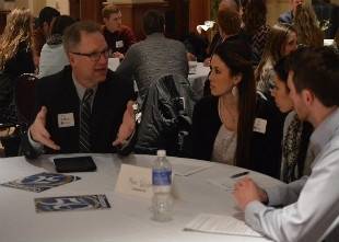 Mentor educator advises current students at a GVSU Education Alumni Network event